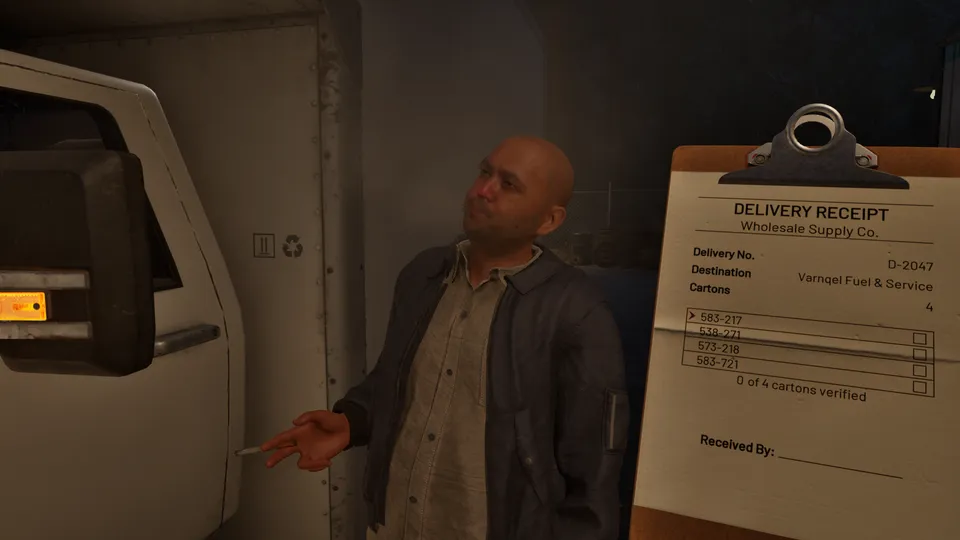 The delivery driver talks next to his truck while Cole checks the receipt
