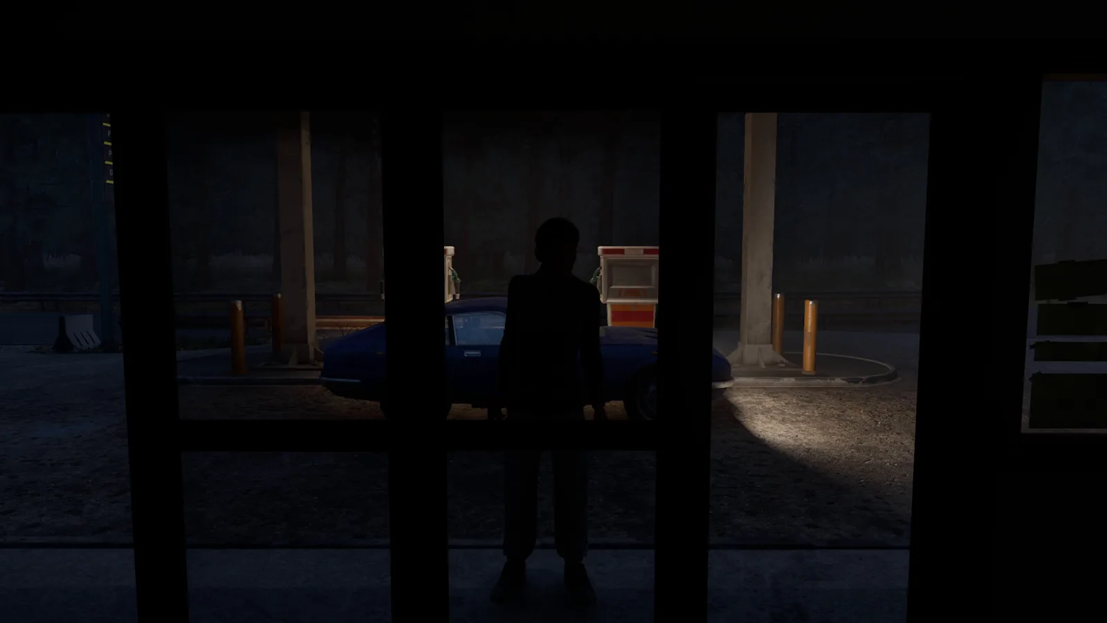 A silhouette stands outside the store's glass doors at night